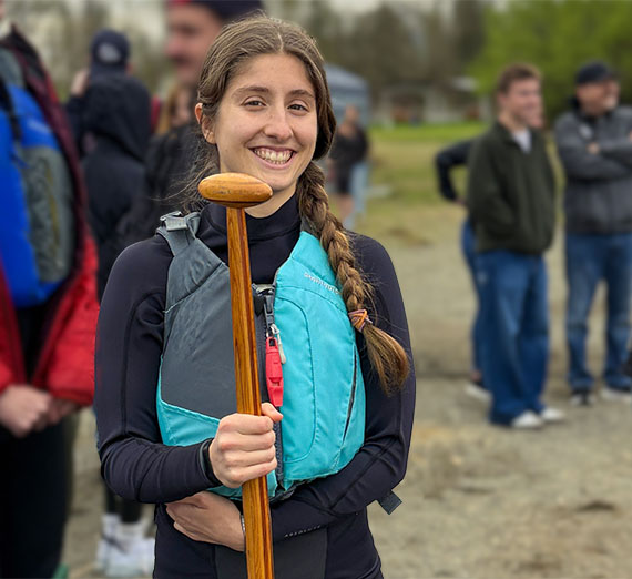 Students weave young pine boughs