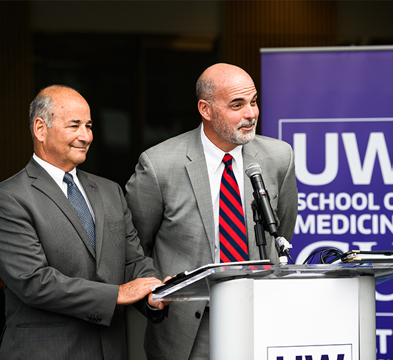 two men at podium