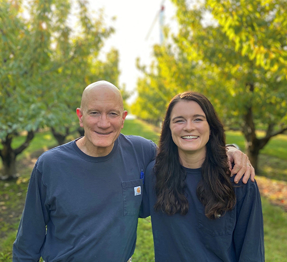 father and daughter among trees