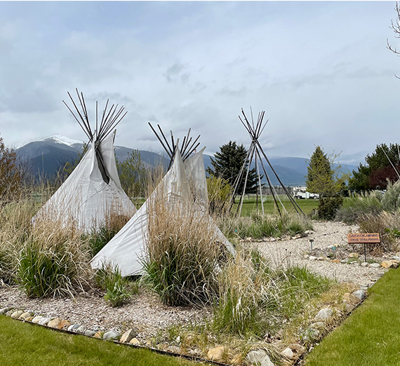 sculptures of native americans and jesuit
